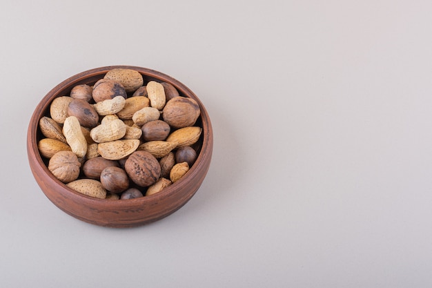 Assortment of shelled organic nuts placed on white background. High quality photo