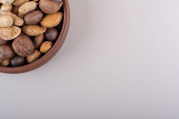 Assortment of shelled organic nuts placed on white background. High quality photo