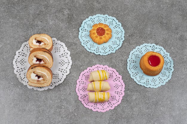 Assortment of sweet desserts on marble surface