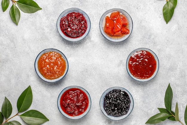 Free photo assortment of sweet jams and seasonal fruits and berries,top view