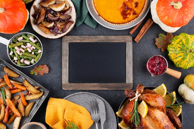 Assortment of thanksgiving day delicious dinner with blackboard