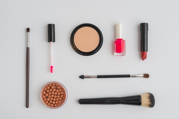 Assortment of various cosmetics products on white background
