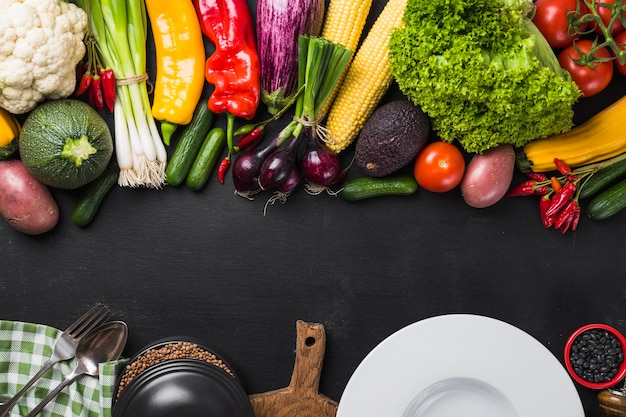 Assortment of vegetables and ceramic plate