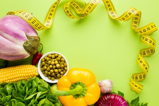 Assortment of veggies on green background