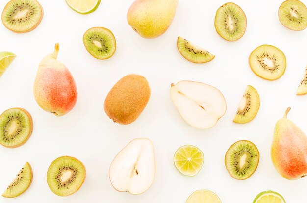 Assortment of whole and sliced tropical fruits