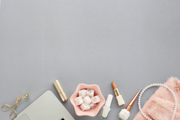 Assortment with beauty products on grey background and copy-space