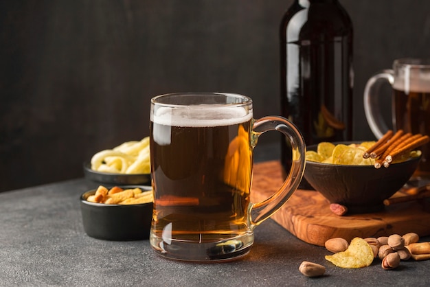 Assortment with beer mug and snacks