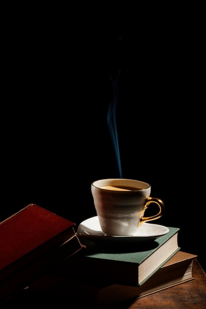 Assortment with books and cup