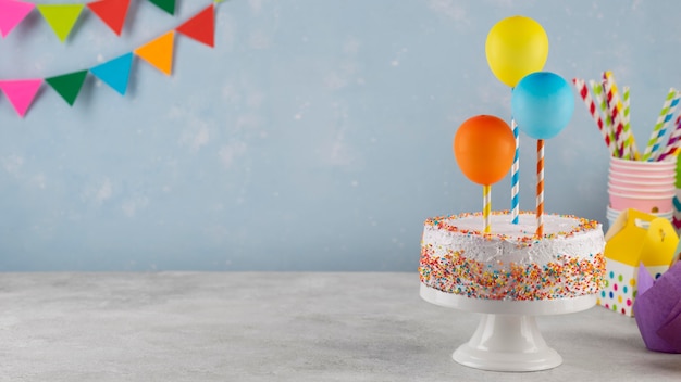 Assortment with cake and balloons