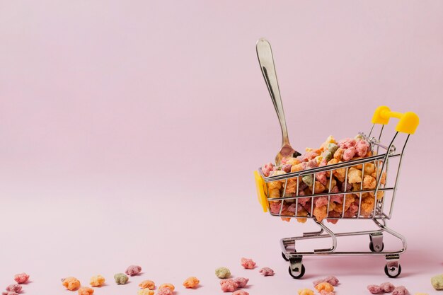 Assortment with cereals in small shopping cart