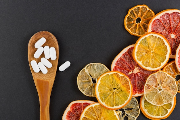 Assortment with citrus slices and black background