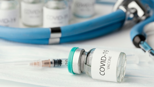 Assortment with coronavirus vaccine bottle