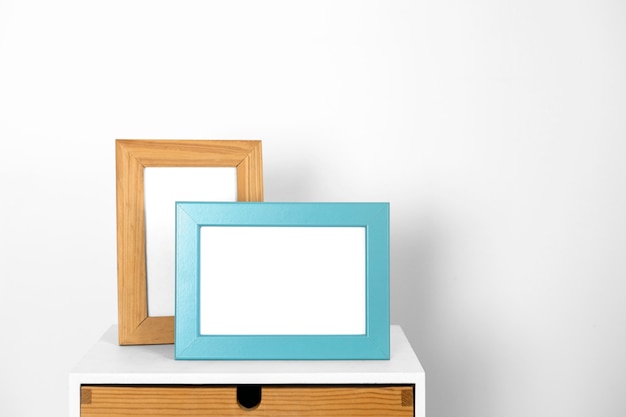 Assortment with empty frames on table