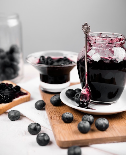 Free photo assortment with jar of blueberry jam