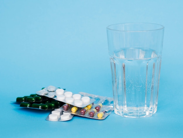 Assortment with medicine and glass