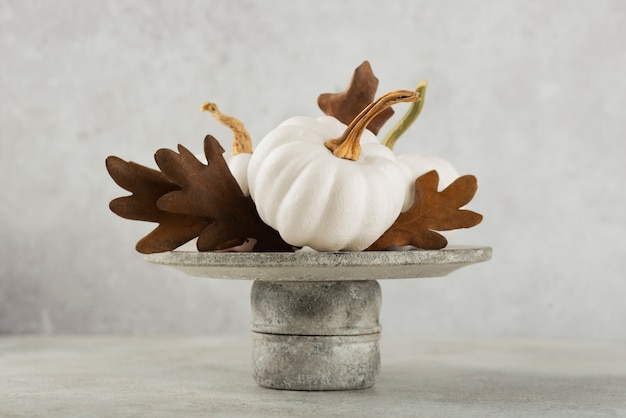 Assortment with white pumpkins and leaves