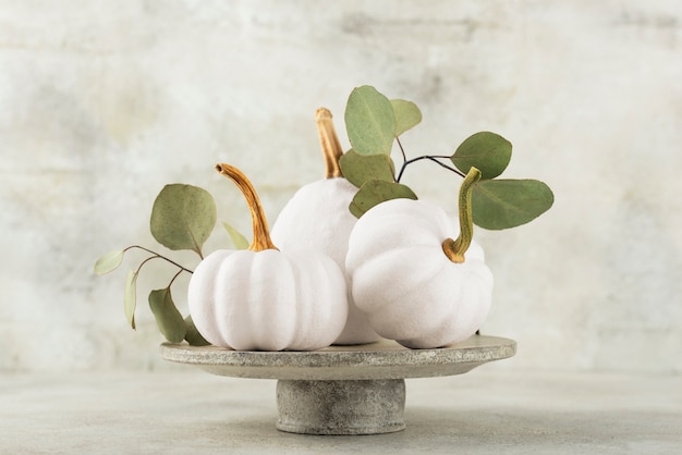 Assortment with white pumpkins and leaves