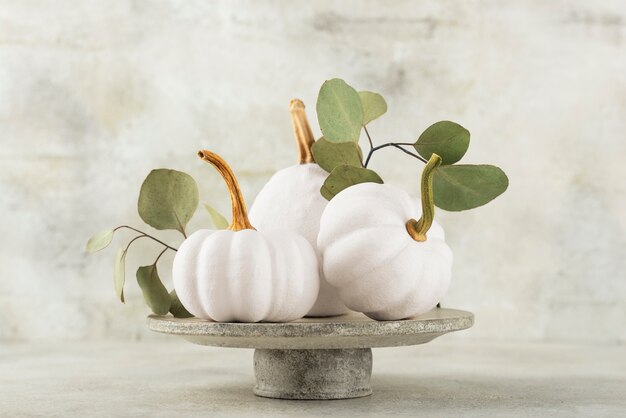 Assortment with white pumpkins and leaves