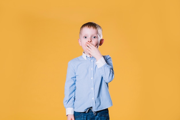 Astonished boy looking at camera