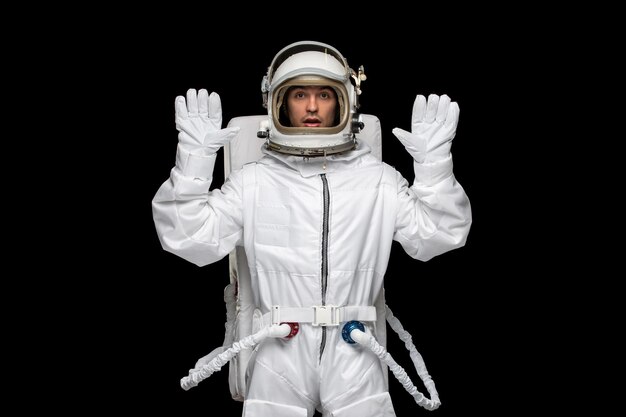 Astronaut day spaceman in galaxy outer space space suit helmet hands up afraid need help