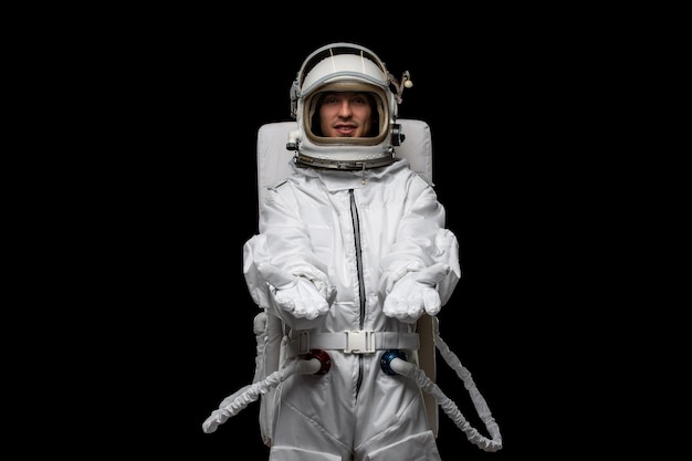 Astronaut day spaceman in white spacesuit design with open hands welcoming open glass helmet