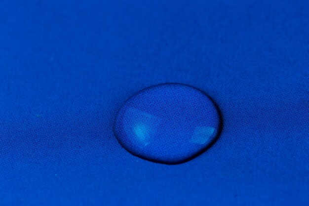 ater drop on blue cloth