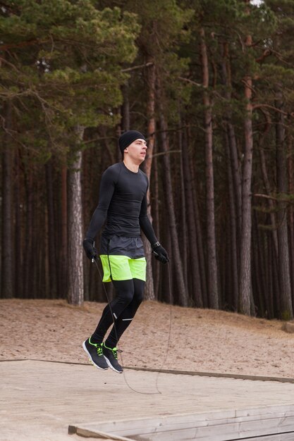 Athlete jumping over skipping rope