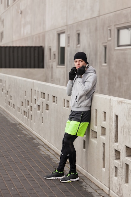 Athlete leaning against wall