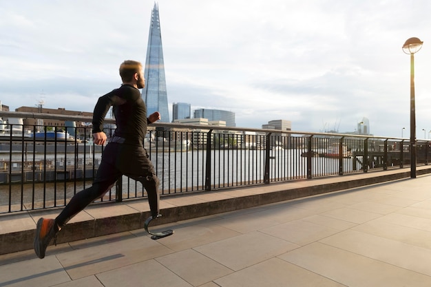 Athlete running with prosthesis full shot