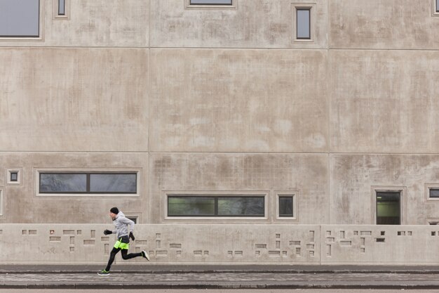 Athlete sprinting in urban environment