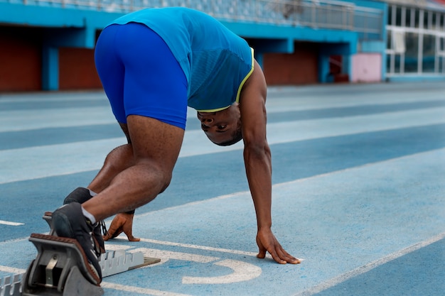 Athlete on the starting line at the stadium