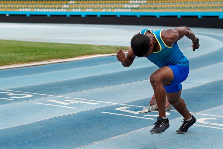 Free Photo athlete on the starting line at the stadium