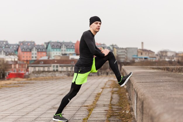 athlete stretching leg