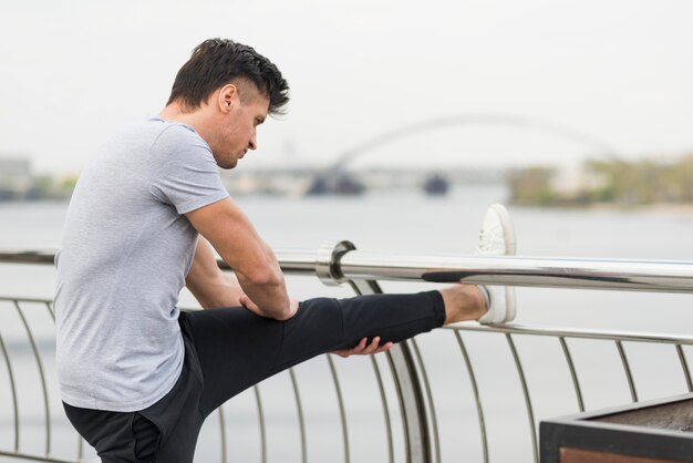 Athlete stretching outdoors before jogging