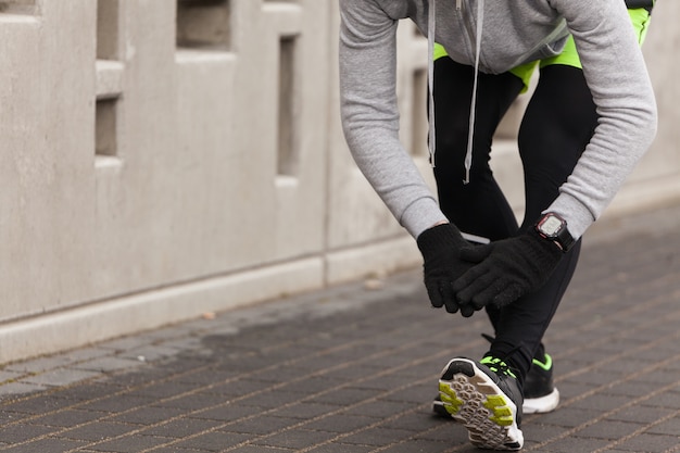 Athlete tying shoes