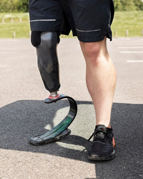 Athlete with prosthetic leg close up