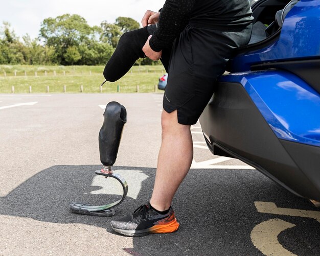 Athlete with prosthetic leg close up