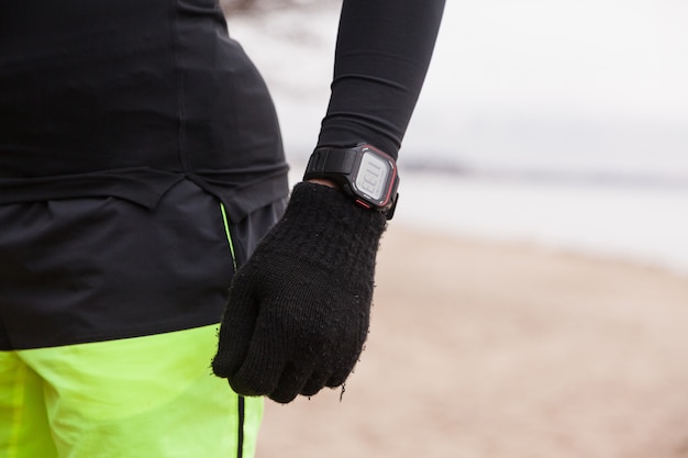 Athlete with watch and gloves