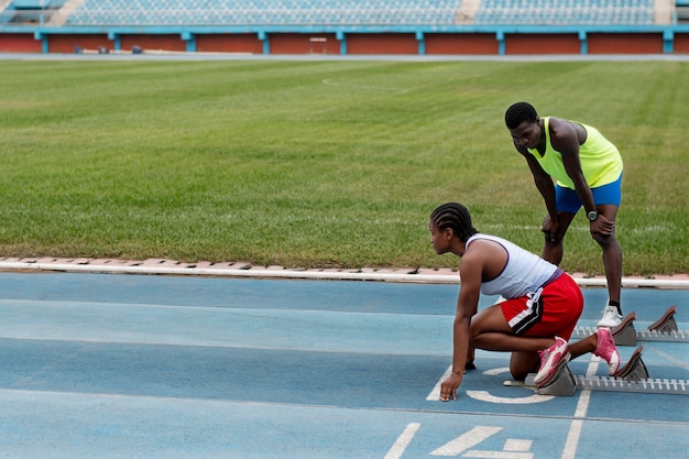 Athletes on the starting line at the stadium