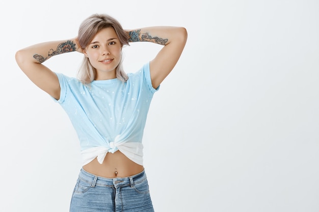 Athletic blonde girl posing in the studio