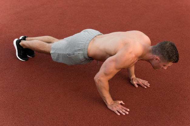 Athletic man doing push ups