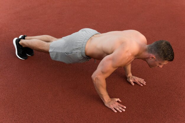 Athletic man doing push ups