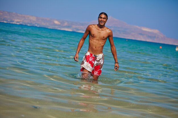 Athletic man enjoying the sea