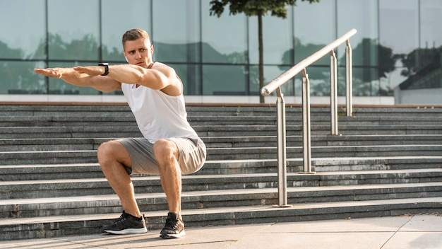 Athletic man exercising outside