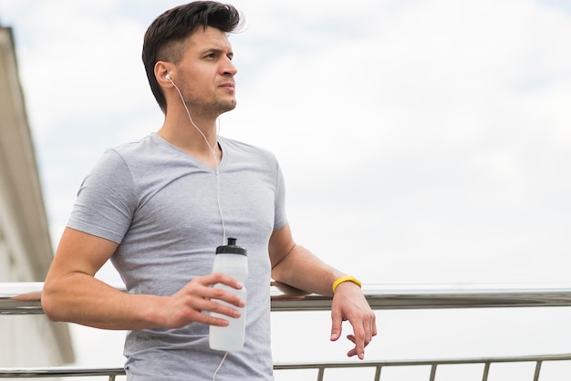 Athletic man getting ready for jogging