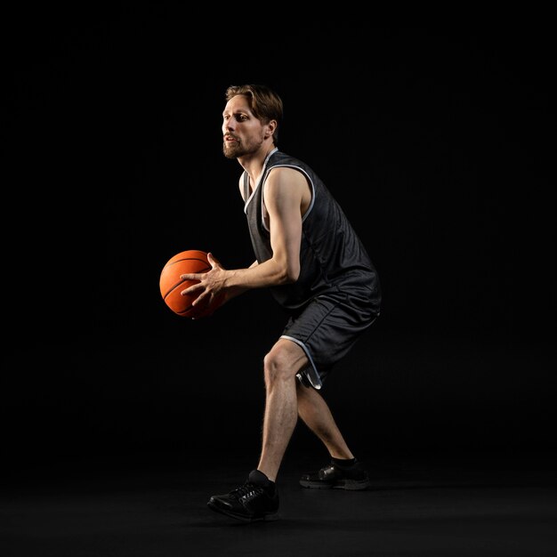 Athletic man holding a basketball