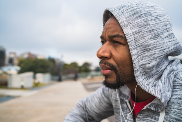 Athletic man listening to music.