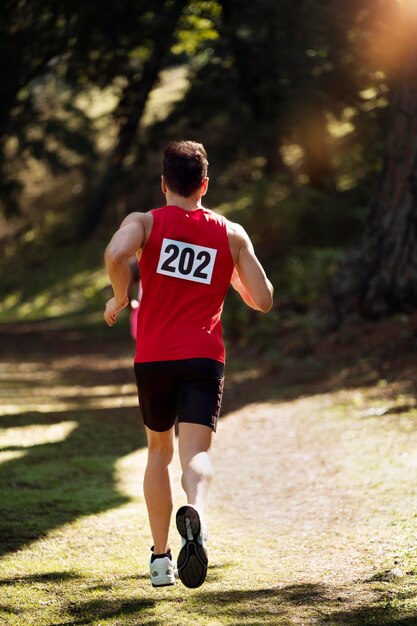 Athletic man participating in a cross country