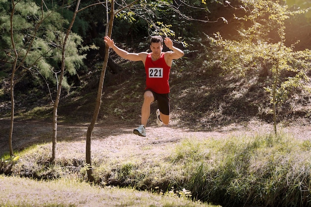 Athletic man participating in a cross country