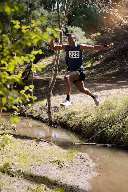 Athletic man participating in a cross country